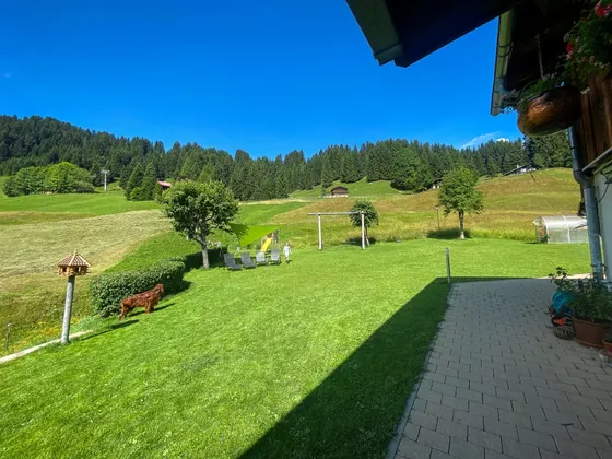 Garden with a stream and play area at Gondamaika
