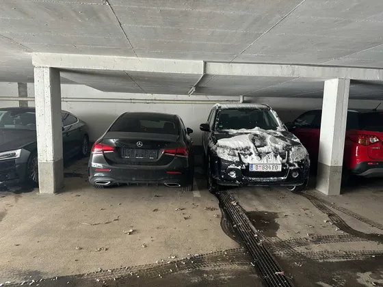 Underground car park at the Gondamaika house in Hirschegg with parked cars in winter, Kleinwalsertal