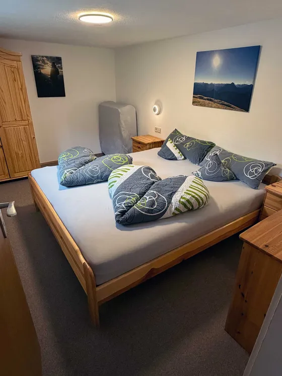 Slaapkamer 1 van Appartement 11 in Hirschegg met tweepersoonsbed